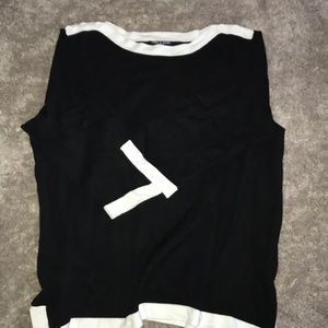 A black tunic with white accents